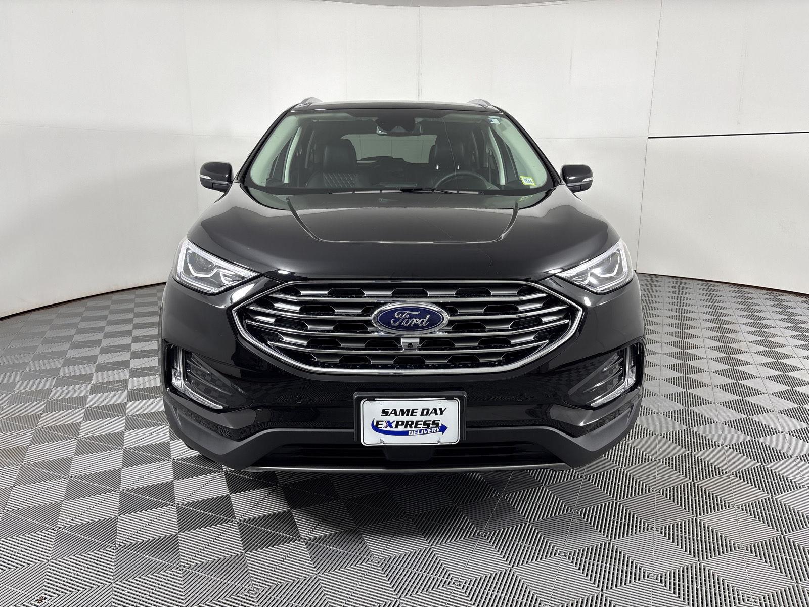 Used 2024 Agate Black Metallic Ford Titanium image 2