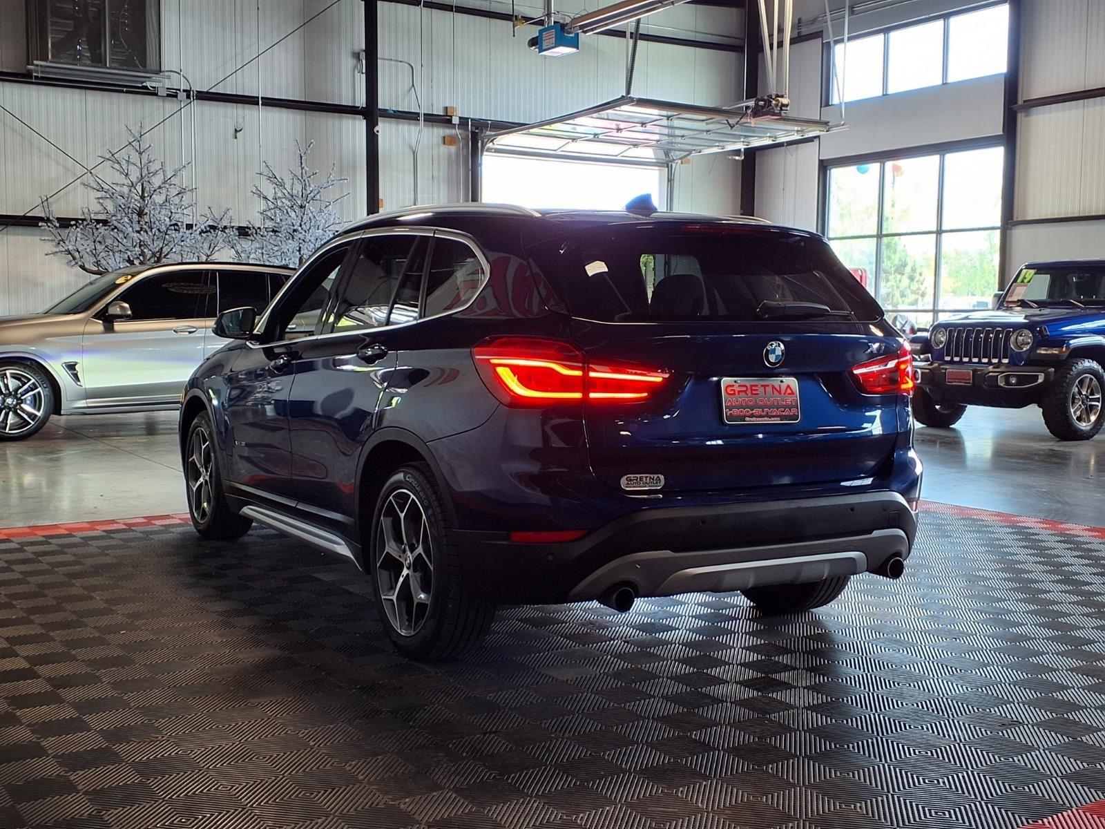 2016 BMW X1 xDrive28i - Mediterranean Blue Metallic exterior view 4