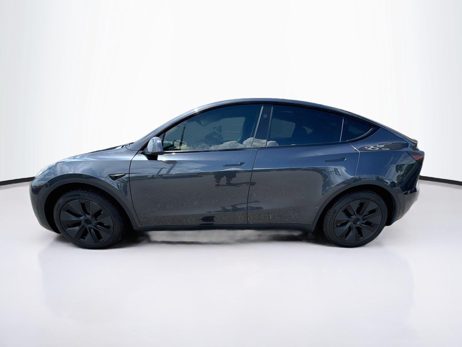 Used 2025 Tesla Model Y Long Range with VIN 7SAYGDED8SA374183 for sale in New Port Richey, FL