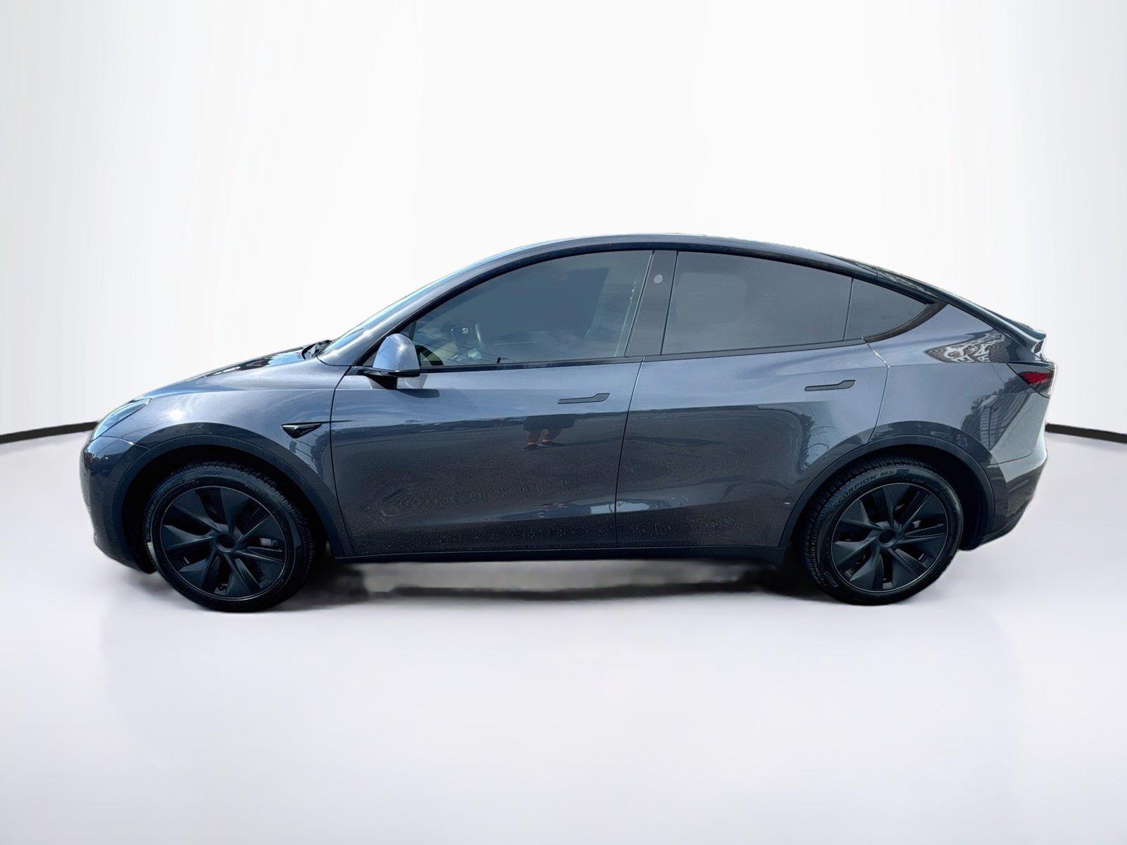 Used 2025 Tesla Model Y Long Range with VIN 7SAYGDED8SA374183 for sale in New Port Richey, FL
