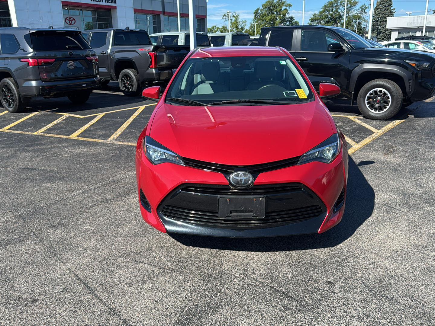 Used 2018 Barcelona Red Metallic Toyota LE image 2