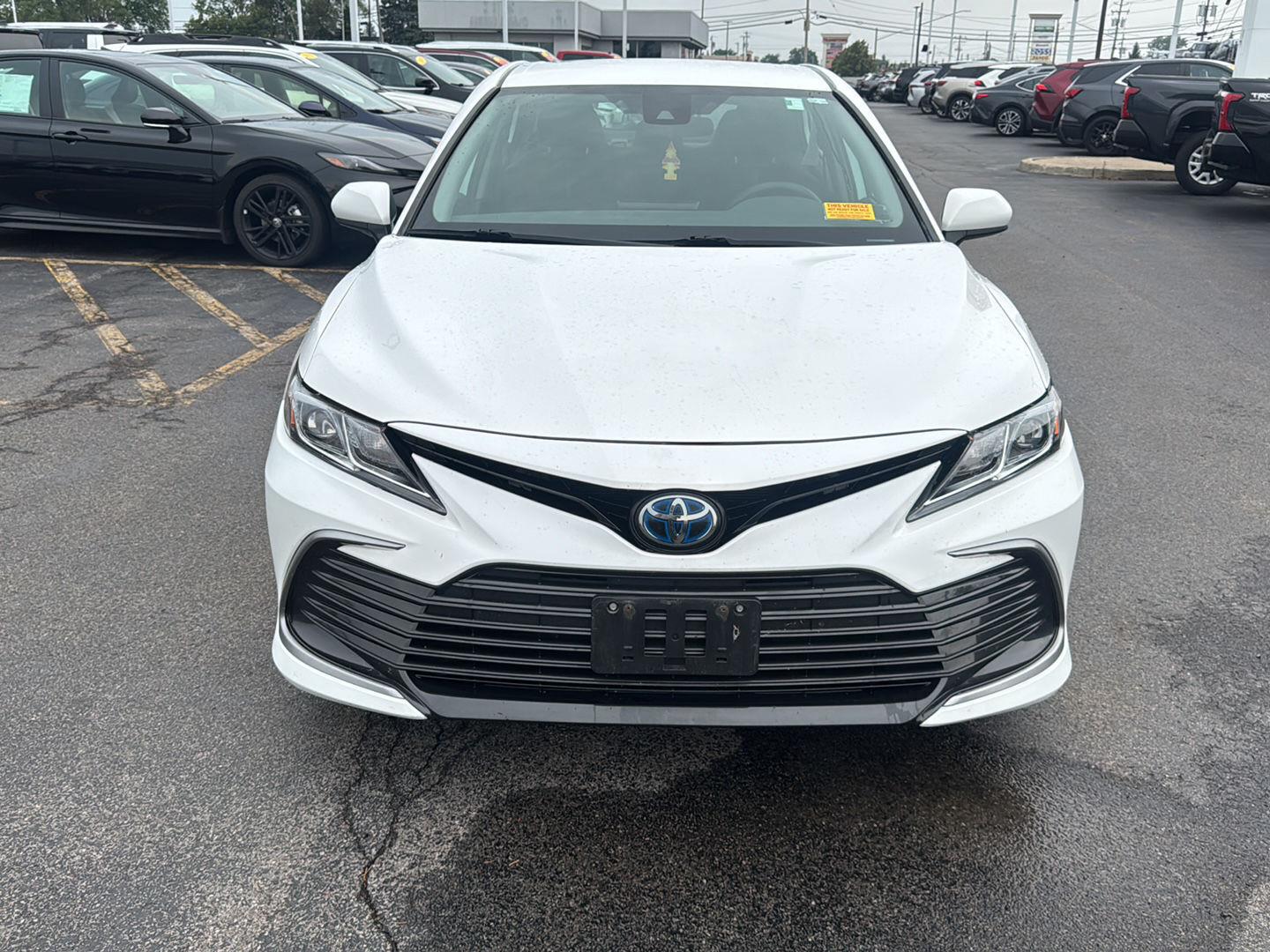 Certified Used 2021 Super White Toyota Hybrid LE image 2