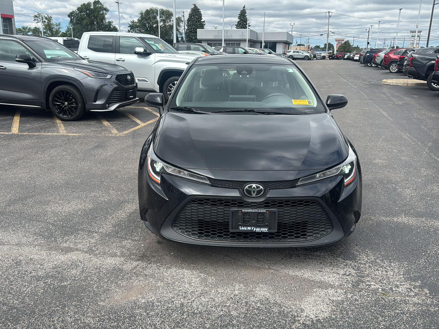 Certified Used 2021 Black Sand Pearl Toyota LE image 2
