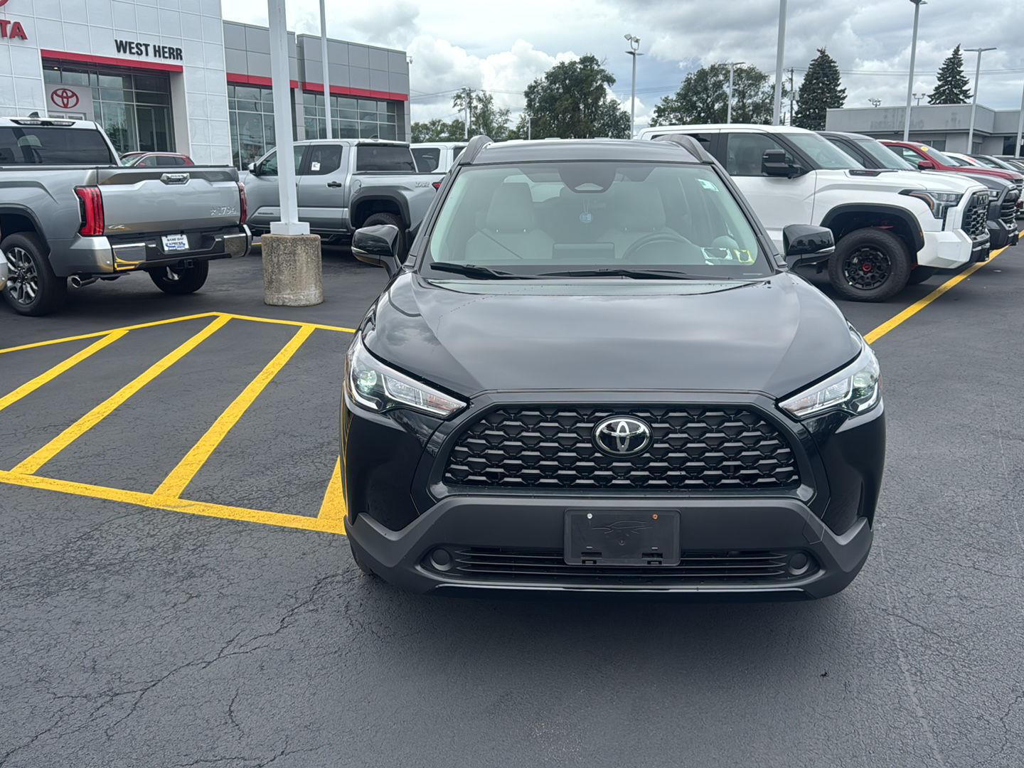 Certified Used 2024 Jet Black Toyota LE image 2