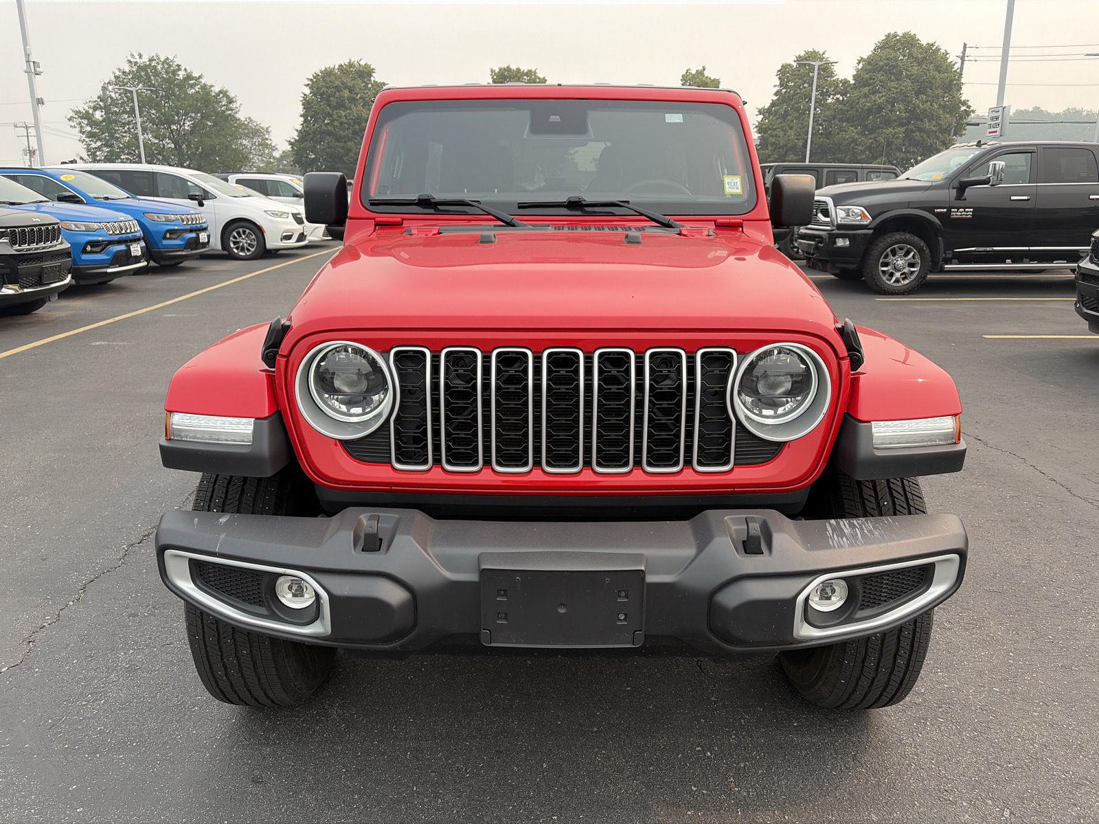 Used 2026 Firecracker Red Jeep Sahara image 2