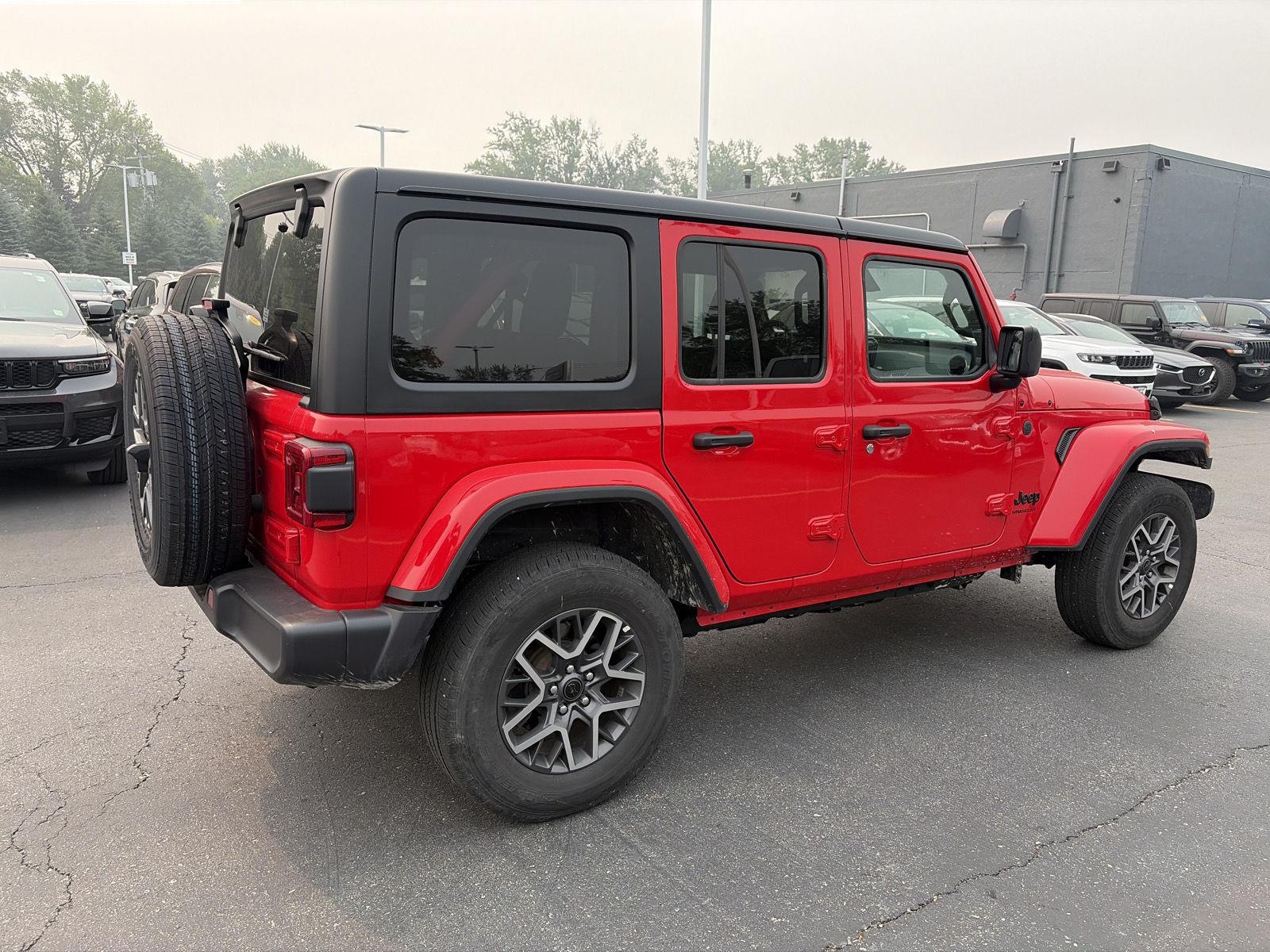 Used 2026 Firecracker Red Jeep Sahara image 7