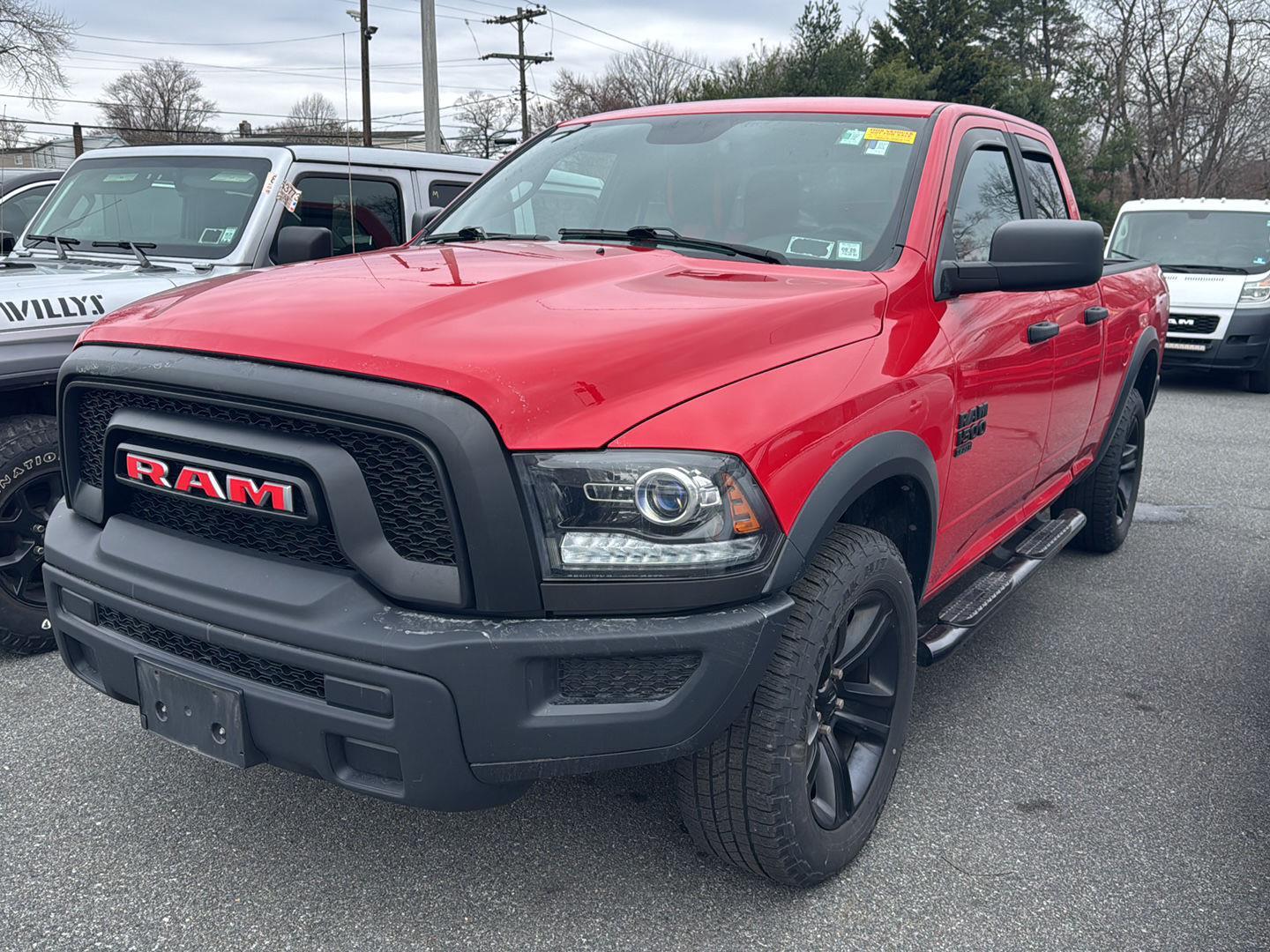 Flame Red Clearcoat 2022 RAM 1500 Classic Warlock Quad Cab 4WD Pickup Truck Four-Wheel Drive