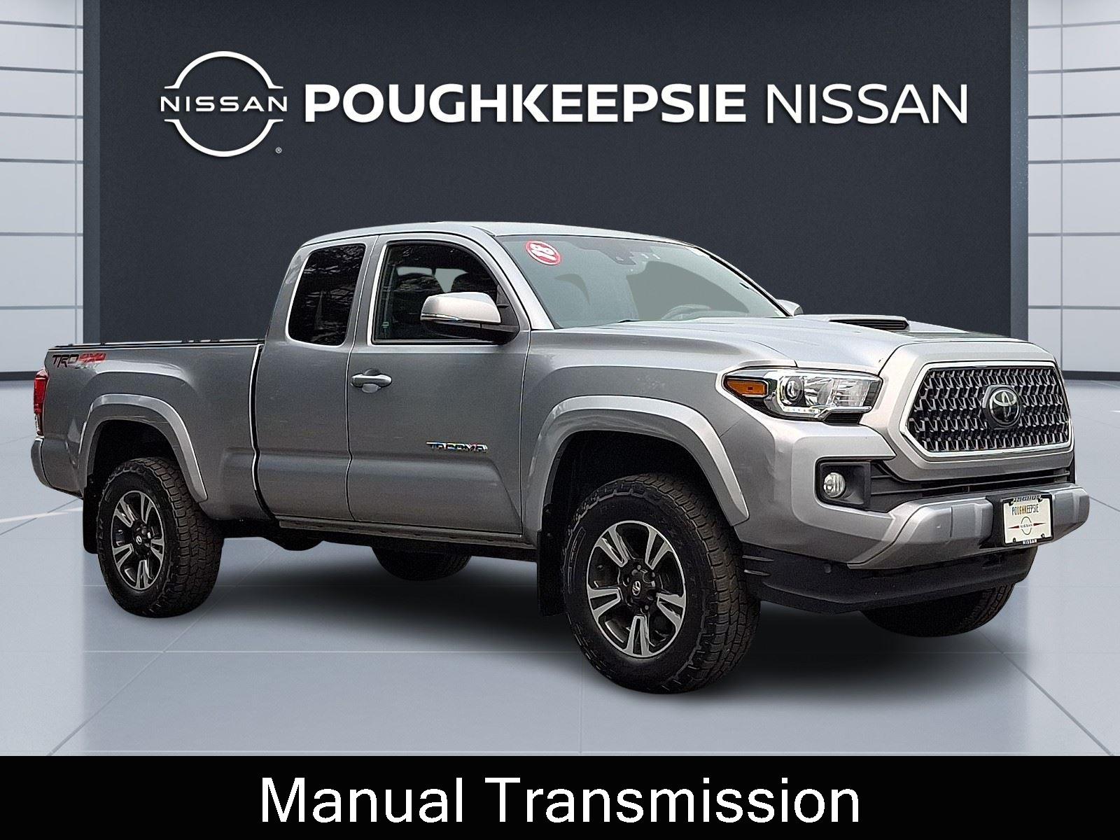 Silver Sky Metallic 2018 Toyota Tacoma Pickup Truck Four-Wheel Drive 6-Speed Manual
