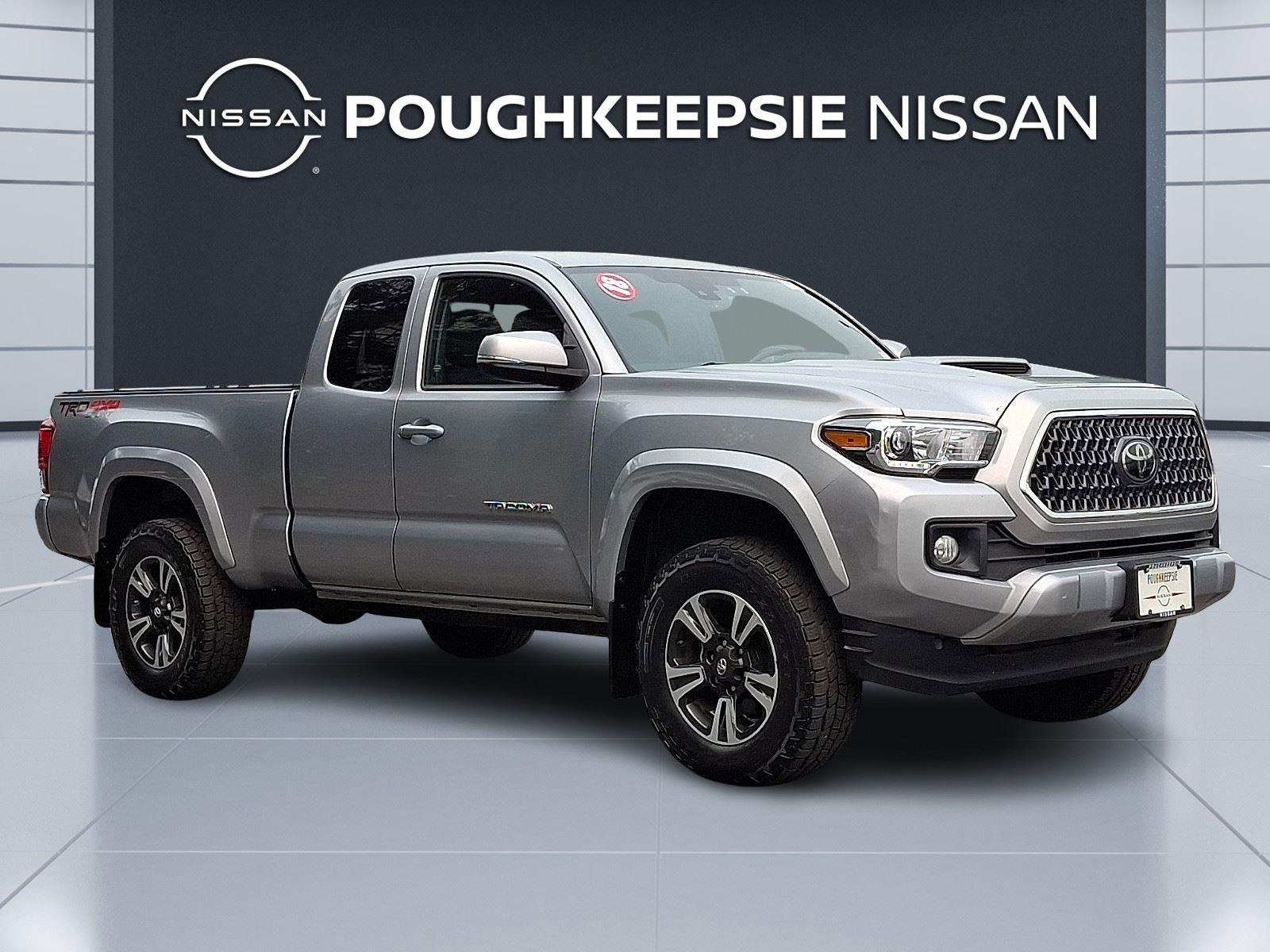 Silver Sky Metallic 2018 Toyota Tacoma Pickup Truck Four-Wheel Drive 6-Speed Manual