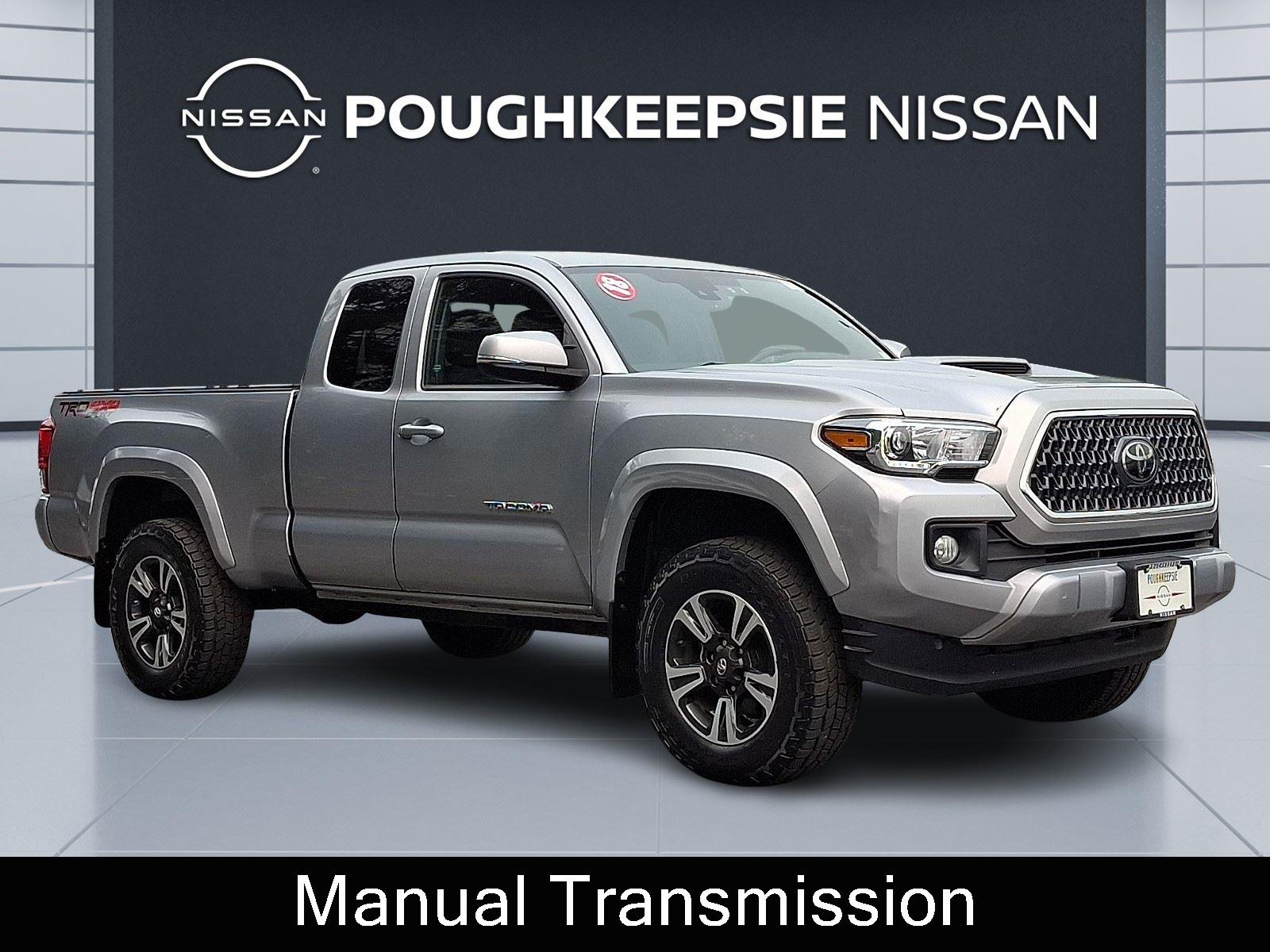 Silver Sky Metallic 2018 Toyota Tacoma Pickup Truck Four-Wheel Drive 6-Speed Manual