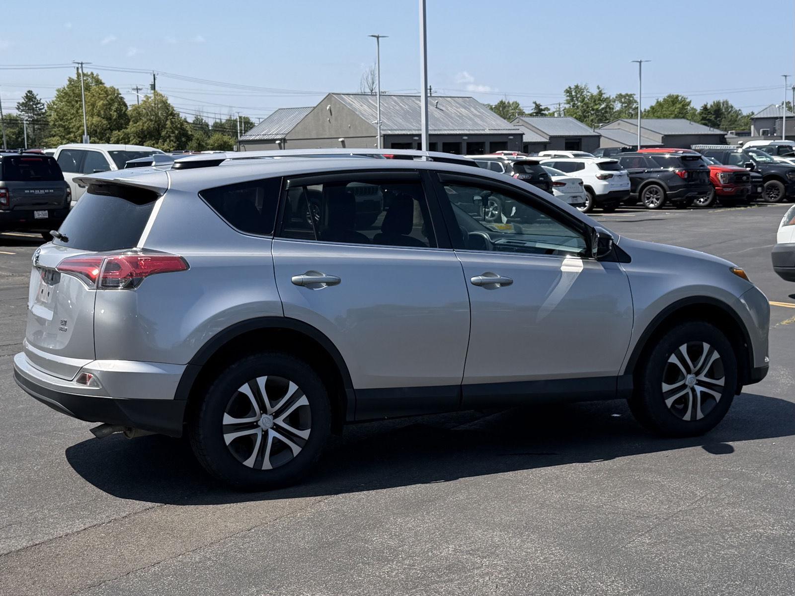 Used 2016 Silver Sky Metallic Toyota LE image 4