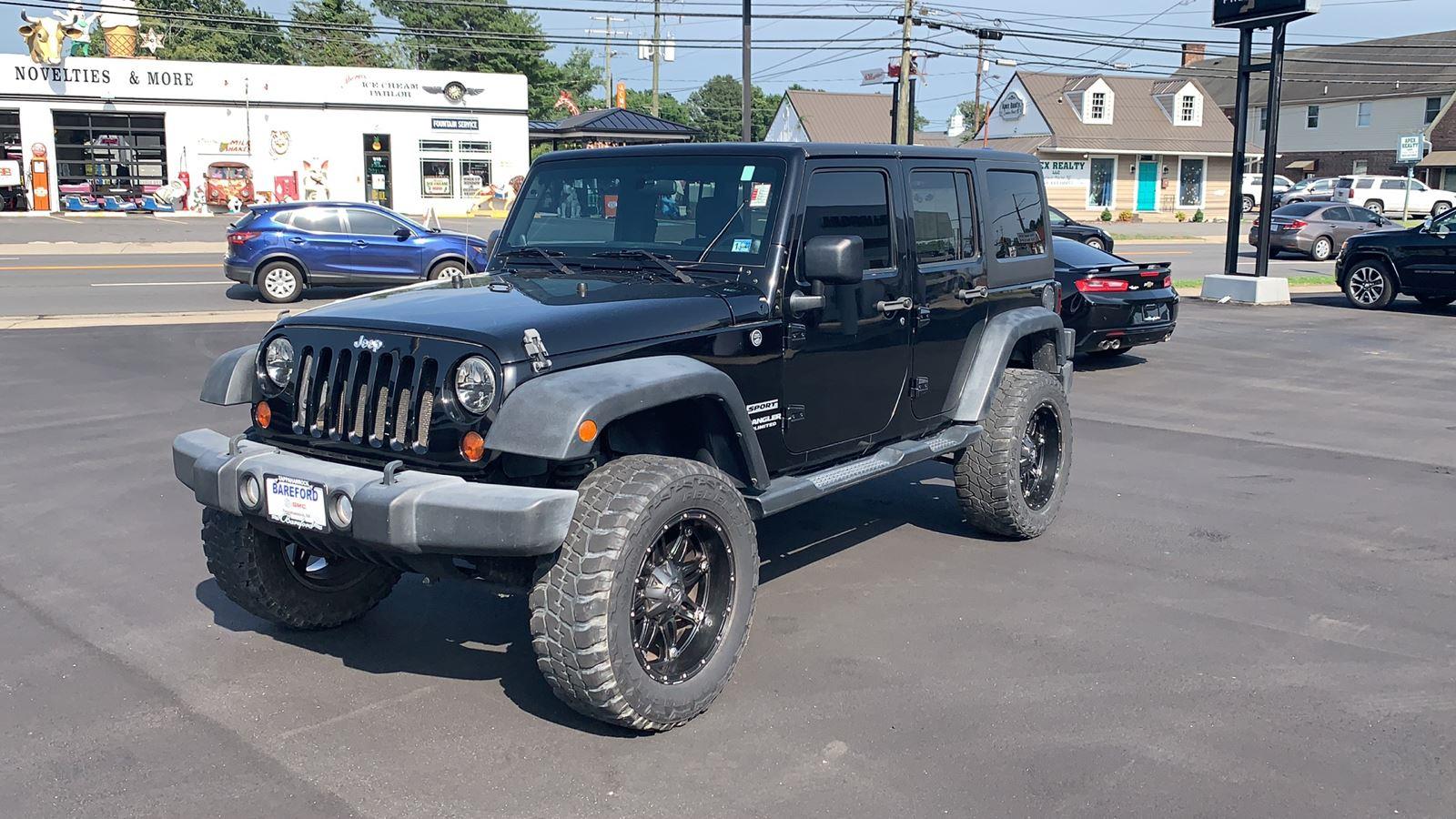 Black 2012 Jeep Wrangler Unlimited Sport 4WD SUV / Crossover Four-Wheel Drive 6-Speed Manual