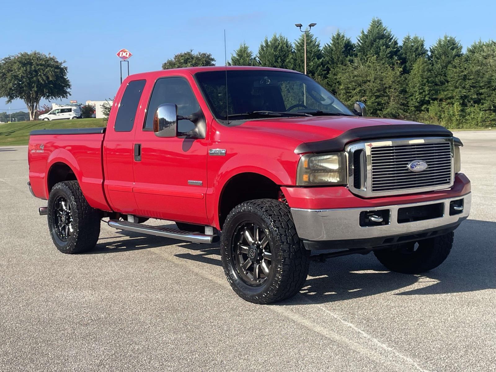 Red 2007 Ford F-250 Super Duty Pickup Truck Four-Wheel Drive