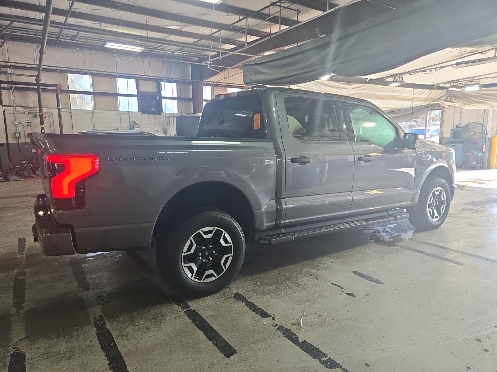 Used 2023 Ford F-150 Lightning XLT with VIN 1FTVW1EL5PWG56103 for sale in New Port Richey, FL