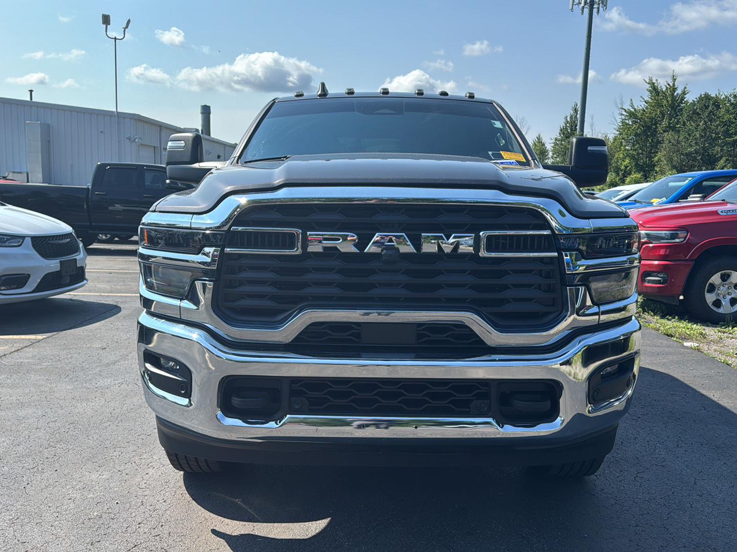 Used 2025 Granite Crystal Metallic Clearcoat Ram Tradesman image 3
