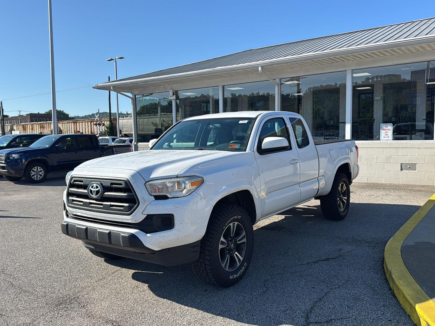 Super White 2016 Toyota Tacoma Pickup Truck Four-Wheel Drive 5-Speed Manual