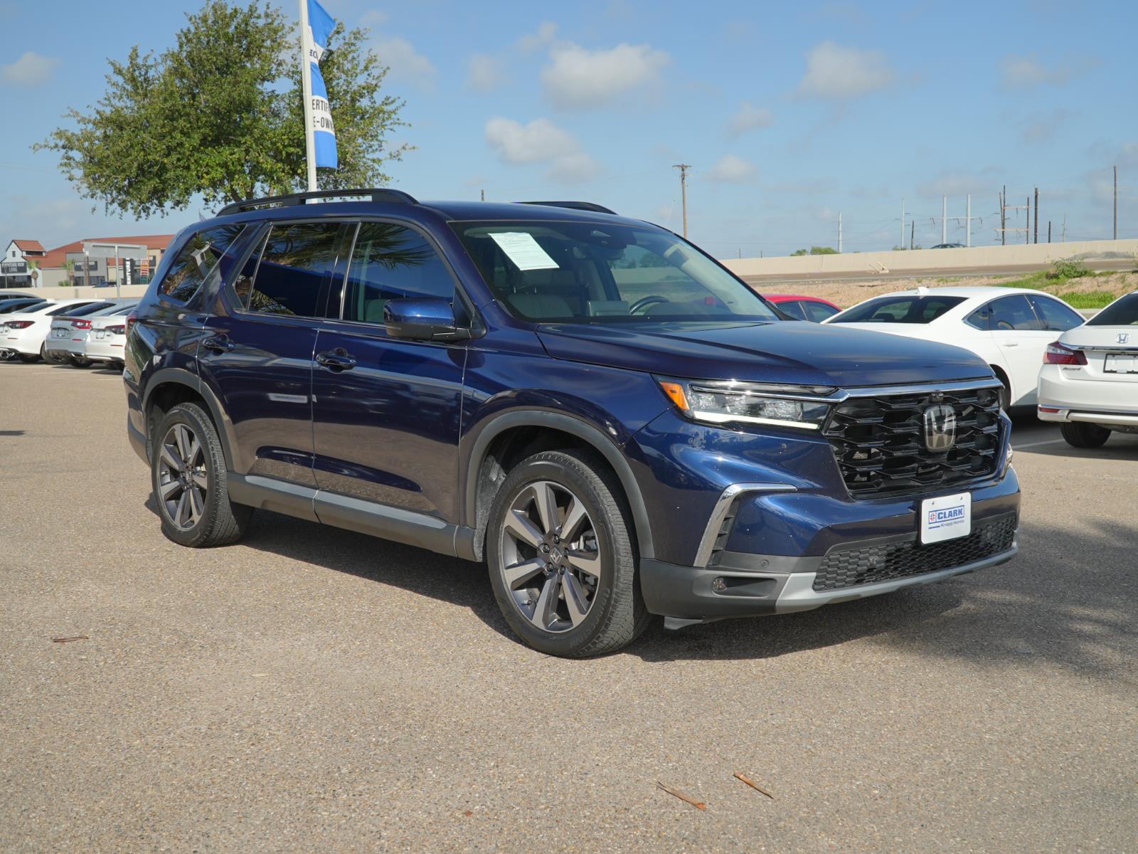 View vehicle photo 3