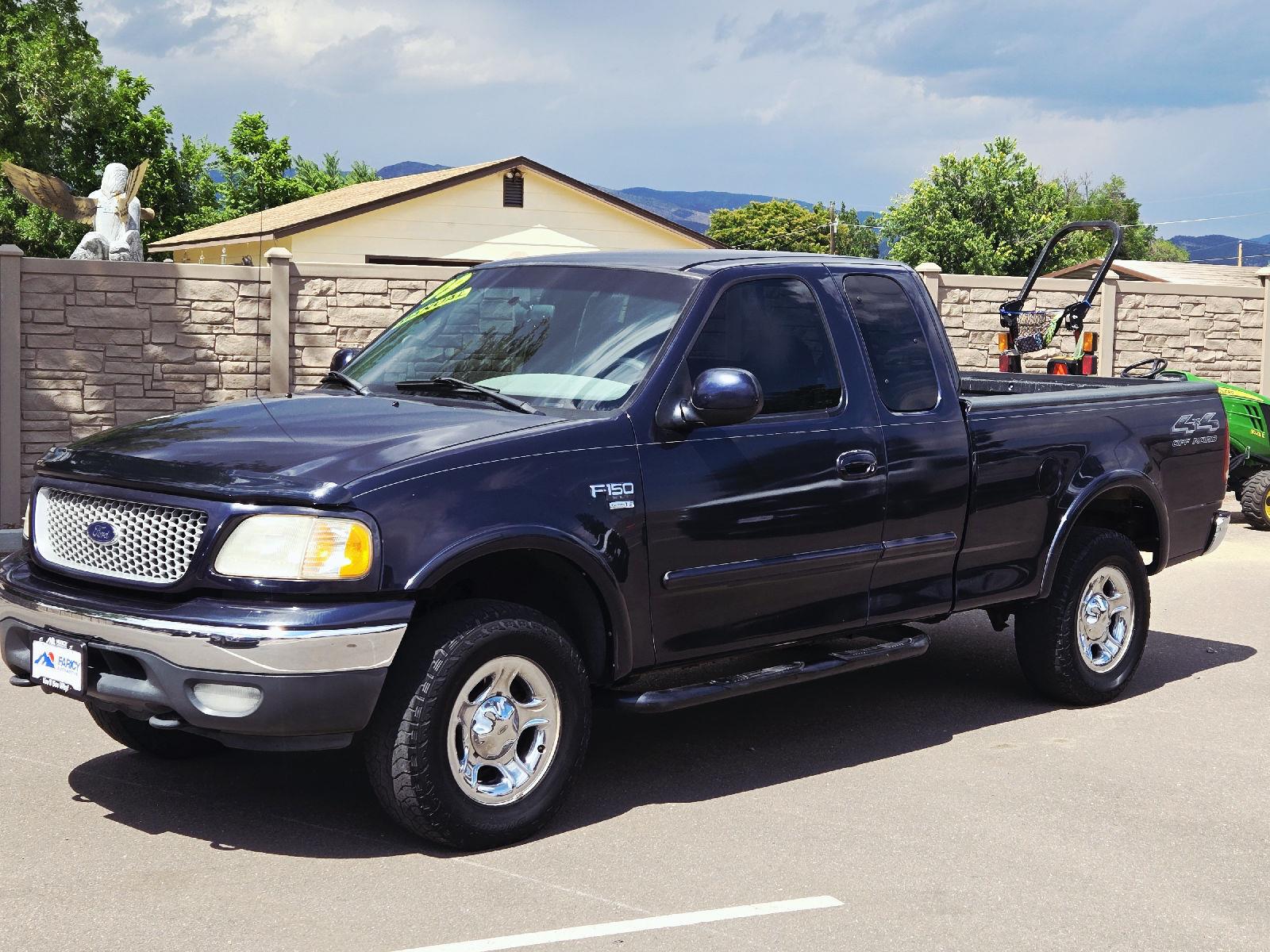 Blue 1999 Ford F-150 Pickup Truck Four-Wheel Drive Automatic