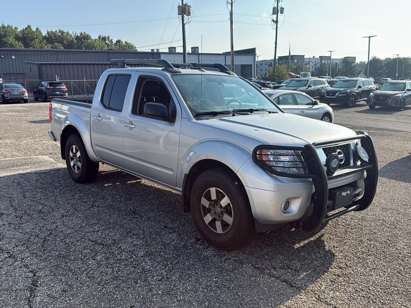 Brilliant Silver 2013 Nissan Frontier Pickup Truck Four-Wheel Drive Automatic