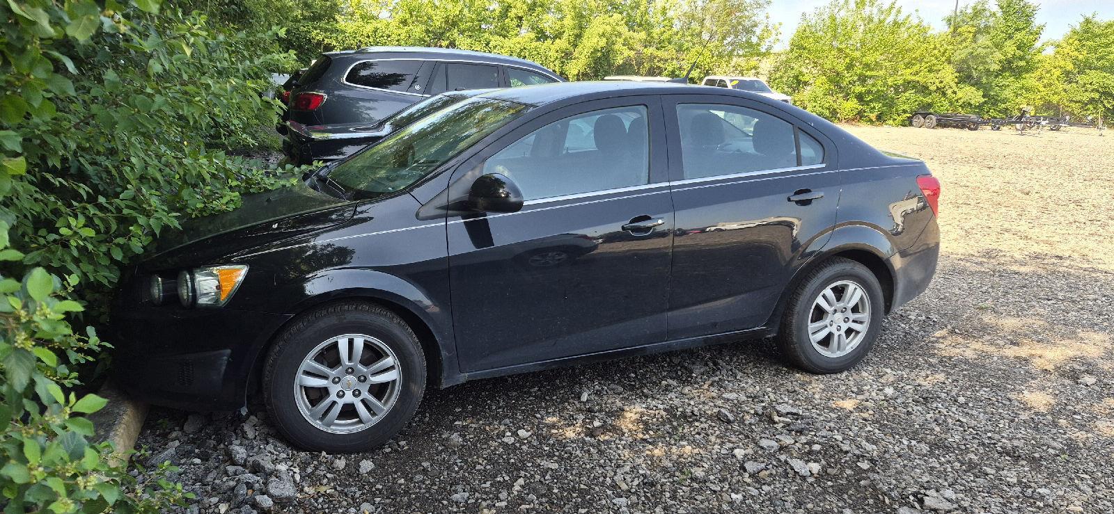 Black 2012 Chevrolet Sonic Sedan Front-Wheel Drive Manual