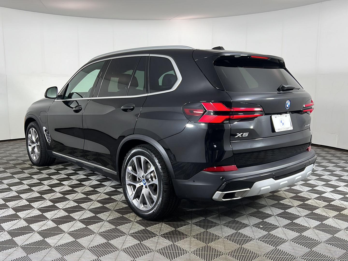 Certified Used 2024 Black Sapphire Metallic BMW xDrive50e image 9