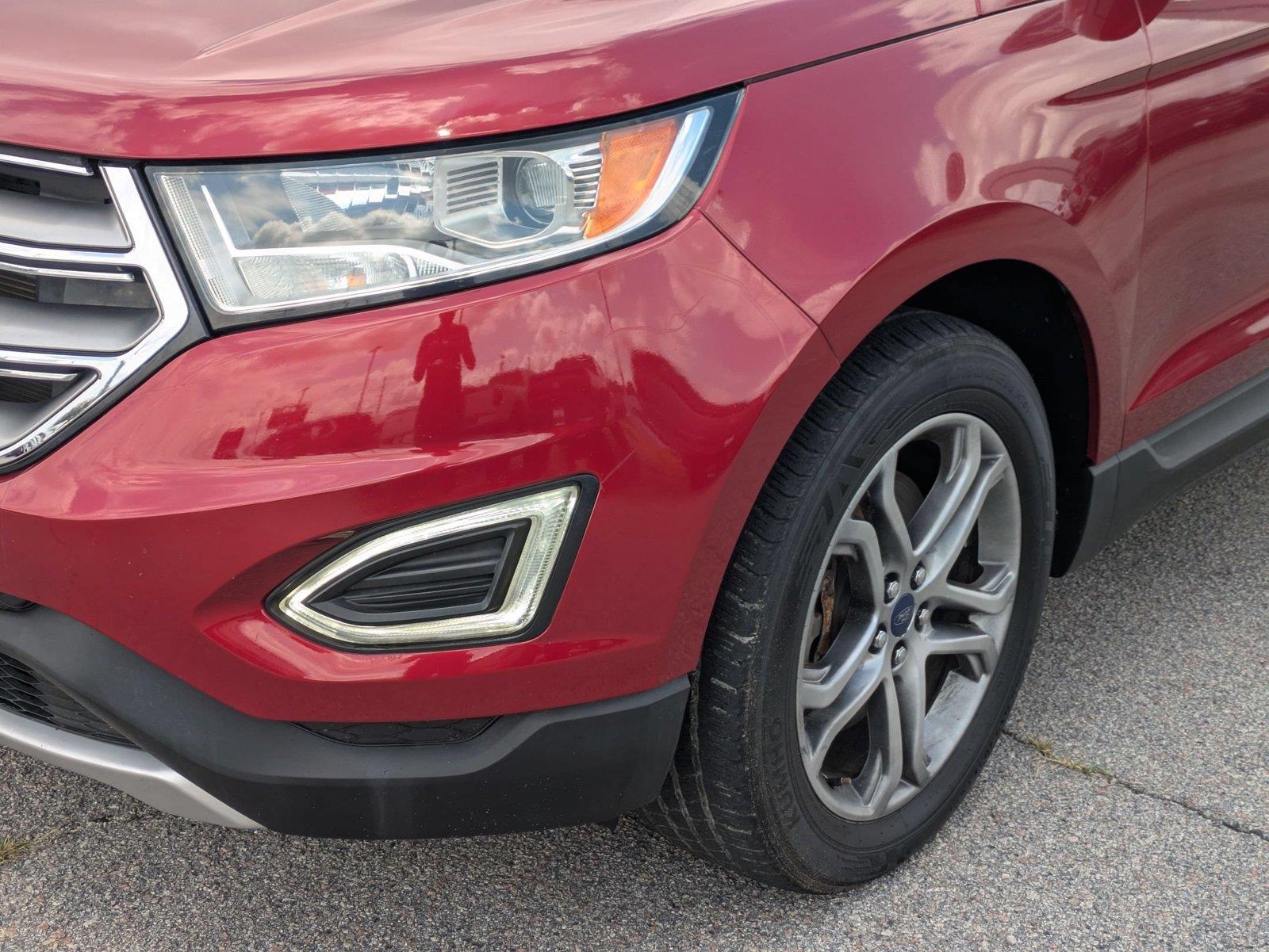 Used 2016 Ruby Red Metallic Tinted Clearcoat Ford Titanium image 9