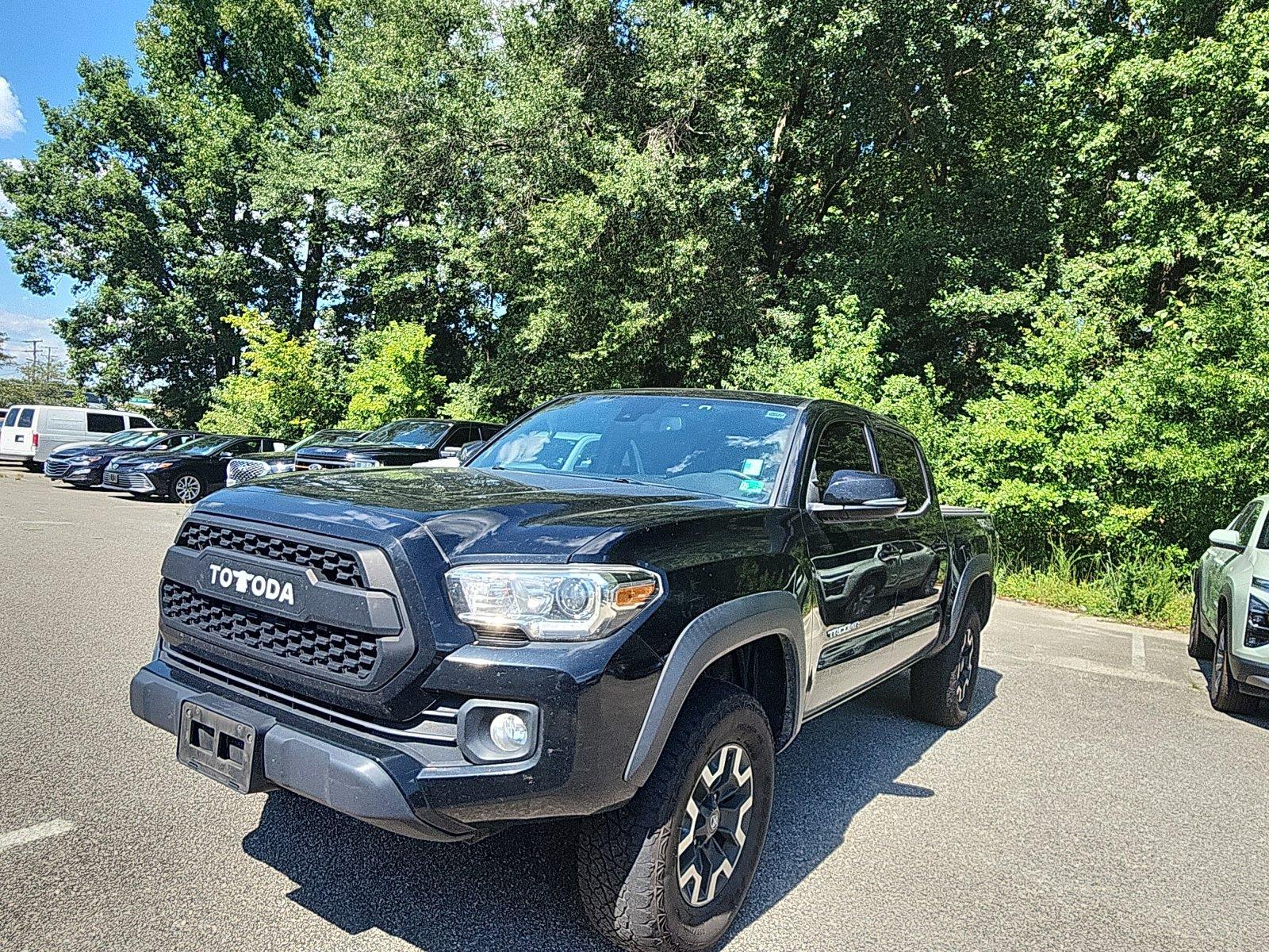 Midnight Black Metallic 2021 Toyota Tacoma Pickup Truck Four-Wheel Drive Manual