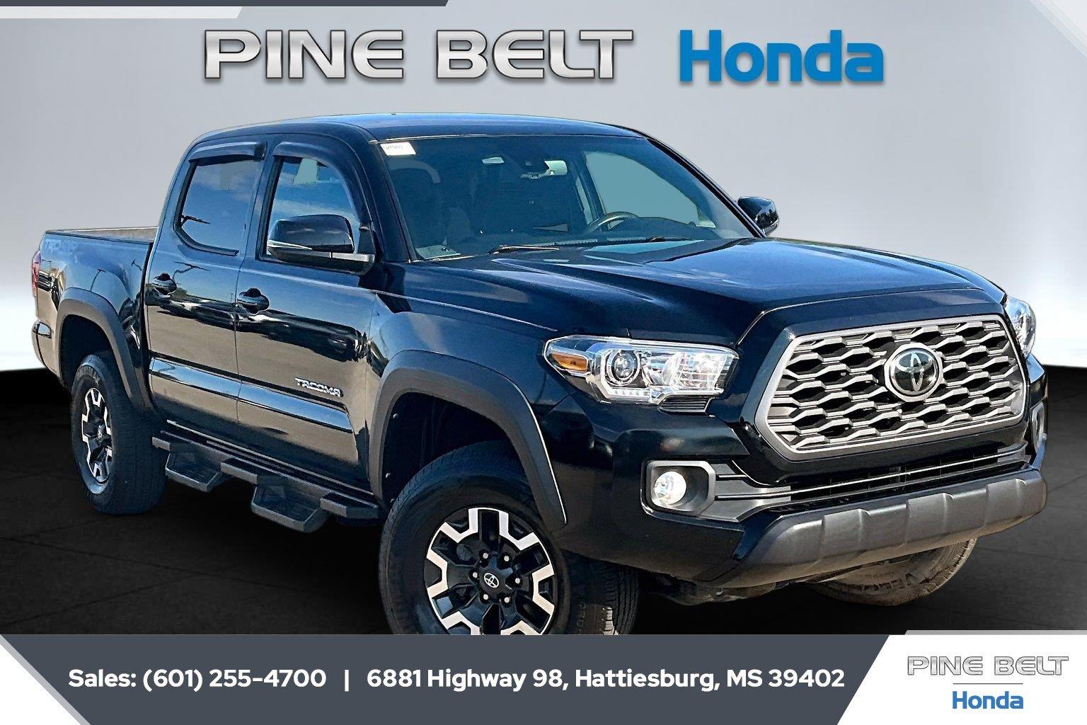 Midnight Black Metallic 2021 Toyota Tacoma Pickup Truck Four-Wheel Drive Manual