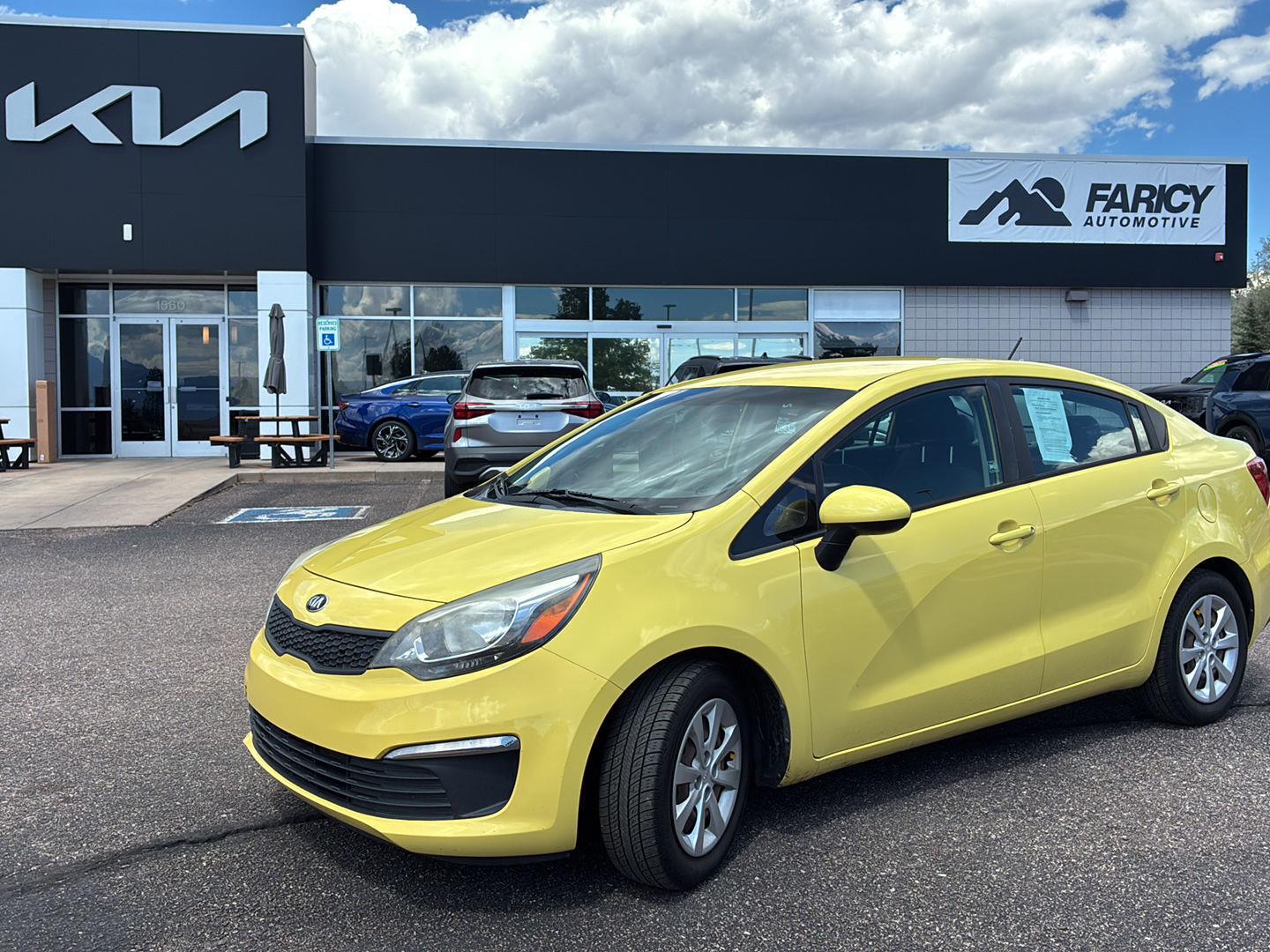 Digital Yellow 2016 Kia Rio Sedan Front-Wheel Drive 6-Speed Automatic