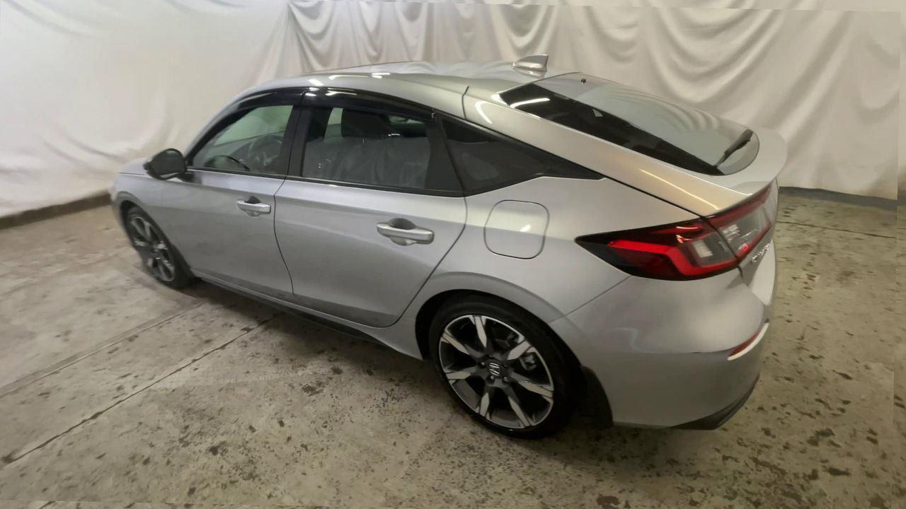 2025 Honda Civic Hatchback Hybrid Sport Touring - Solar Silver Metallic exterior view 6