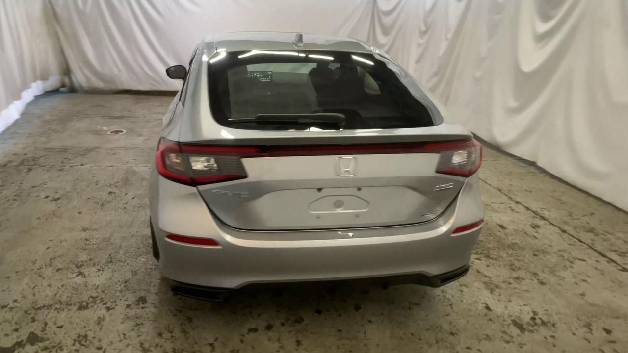 2025 Honda Civic Hatchback Hybrid Sport Touring - Solar Silver Metallic exterior view 7