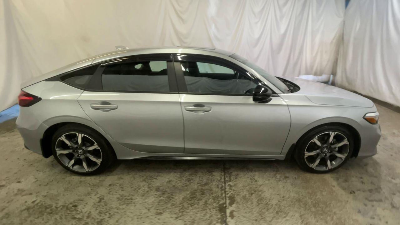 2025 Honda Civic Hatchback Hybrid Sport Touring - Solar Silver Metallic exterior view 9