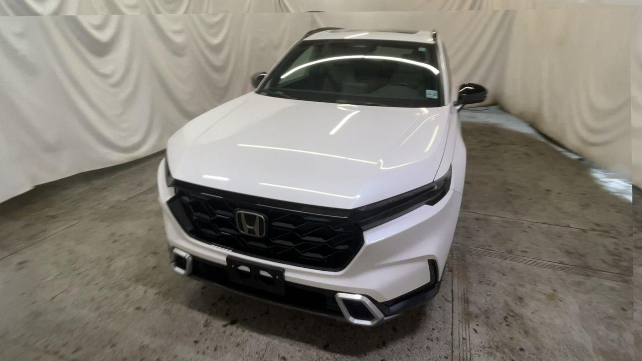 2024 Honda CR-V Hybrid Sport Touring - Platinum White Pearl exterior view 3