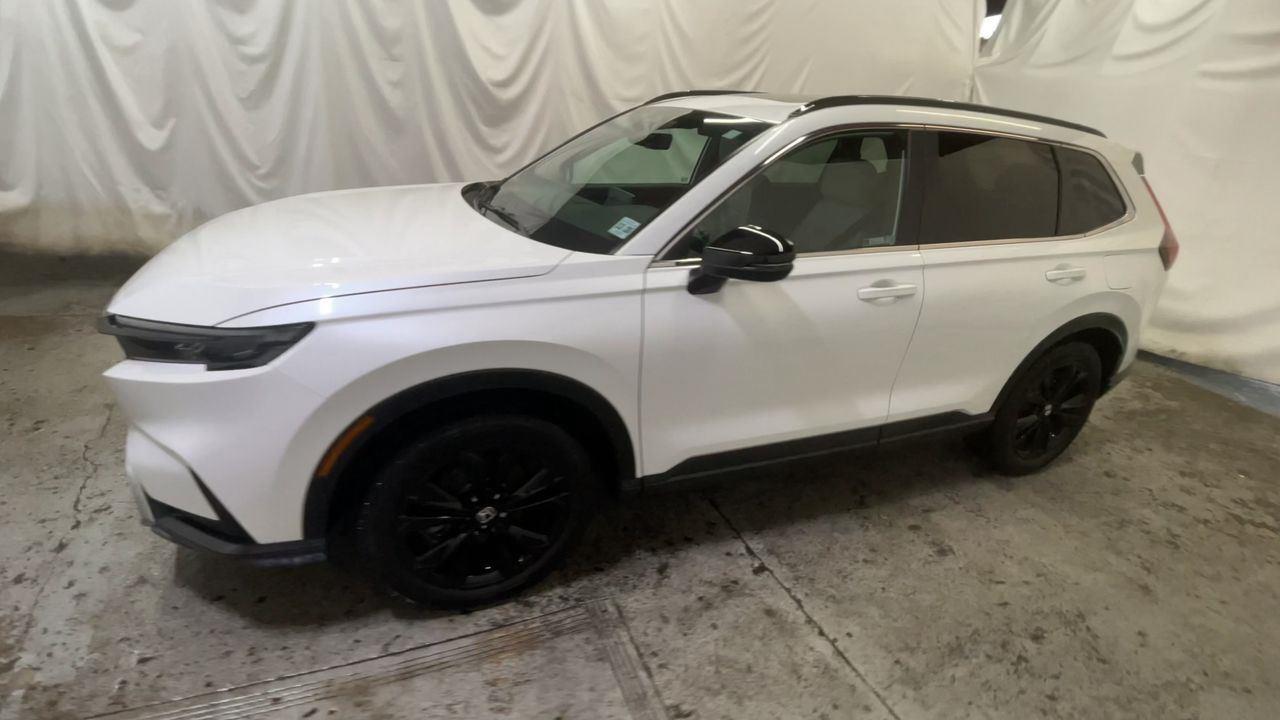2024 Honda CR-V Hybrid Sport Touring - Platinum White Pearl exterior view 4