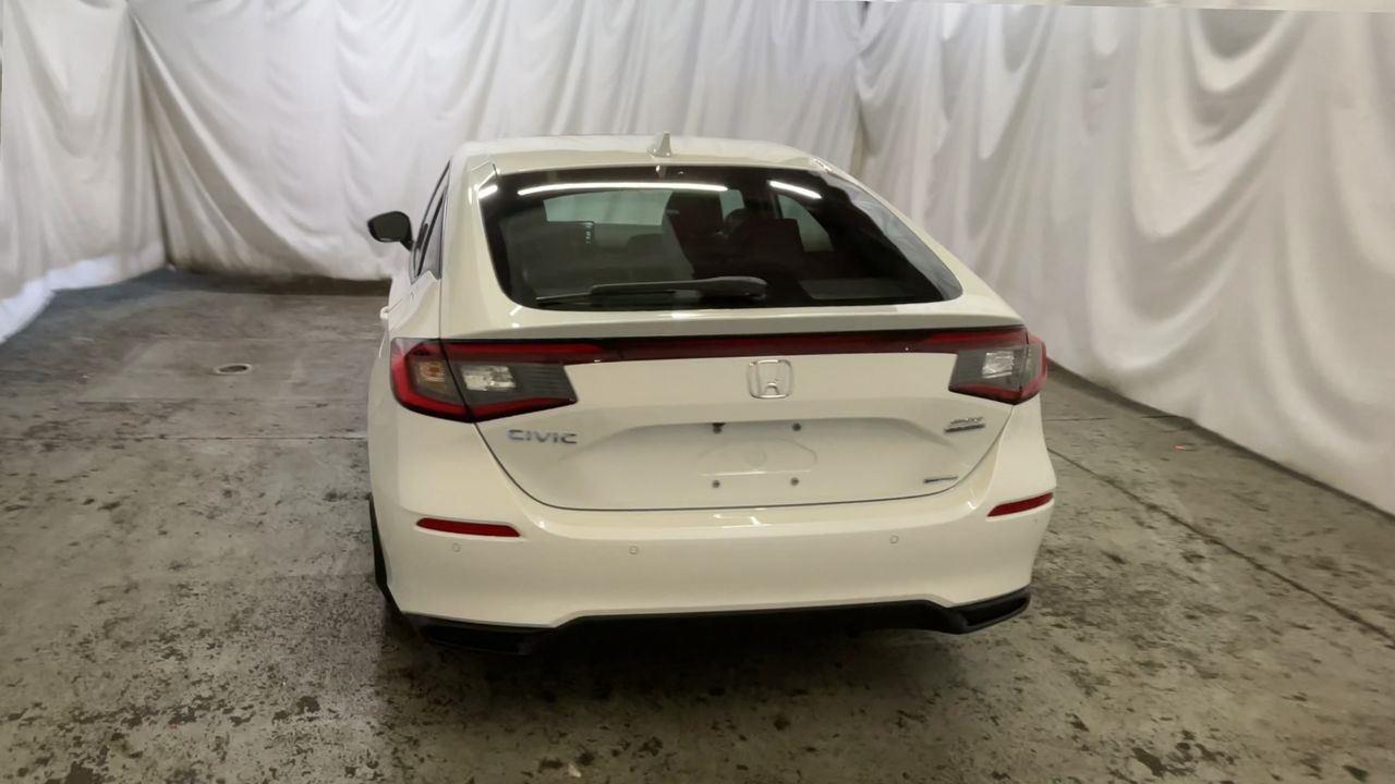 2025 Honda Civic Hatchback Hybrid Sport Touring - Platinum White Pearl exterior view 7