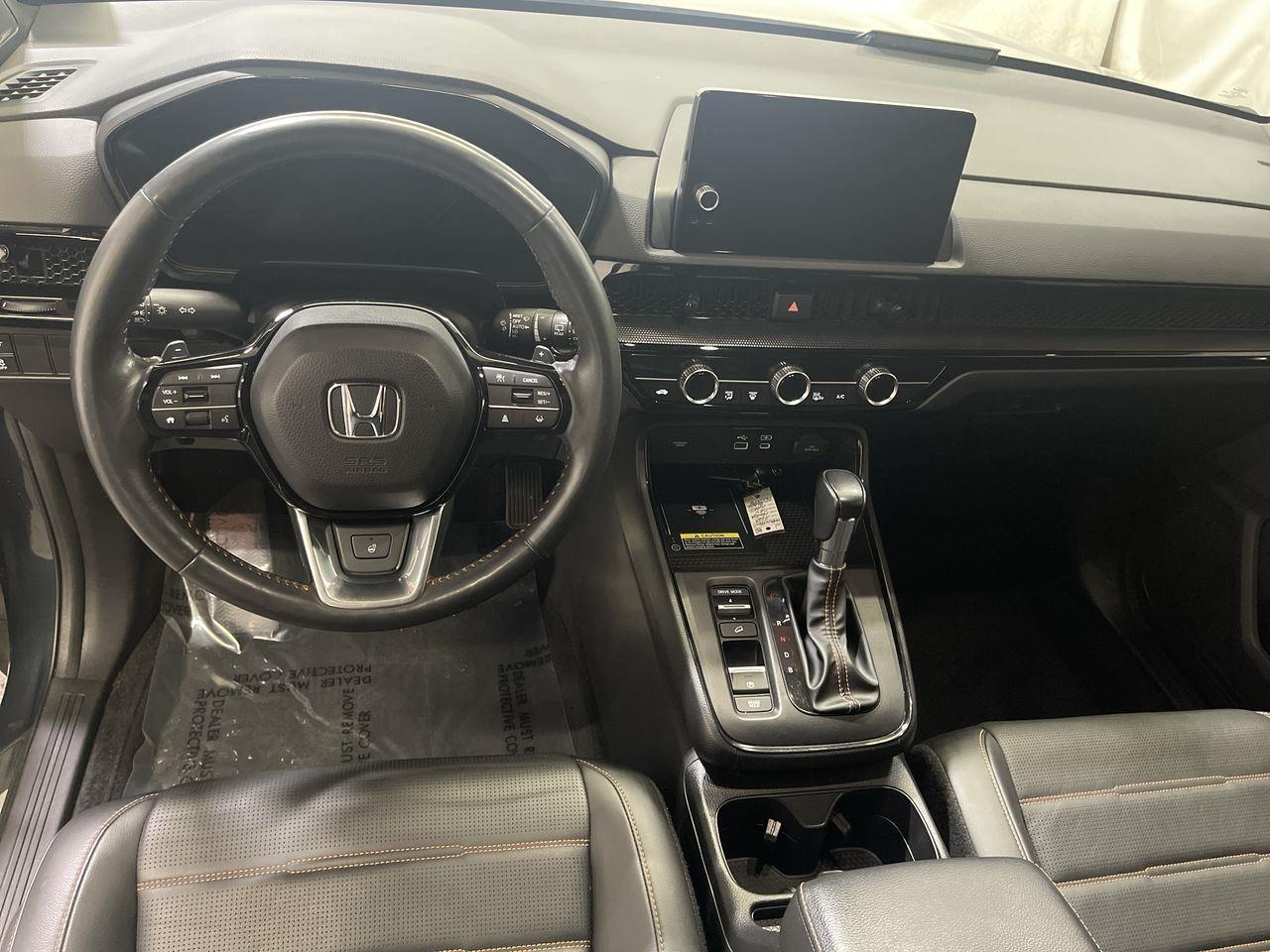 2023 Honda CR-V Hybrid Sport Touring - Meteorite Gray Metallic exterior view 14