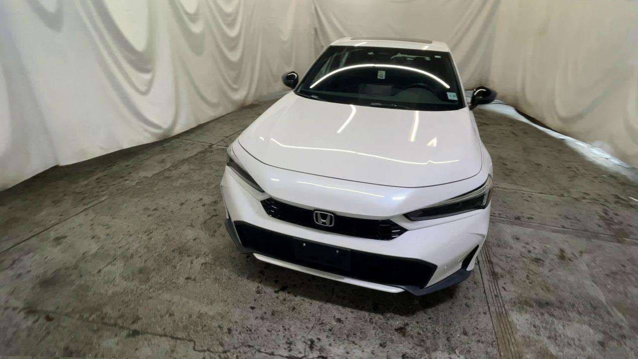 2025 Honda Civic Hatchback Hybrid Sport Touring - Platinum White Pearl exterior view 3