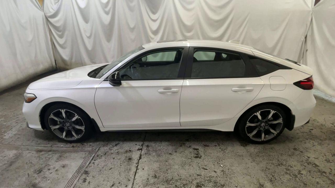 2025 Honda Civic Hatchback Hybrid Sport Touring - Platinum White Pearl exterior view 5