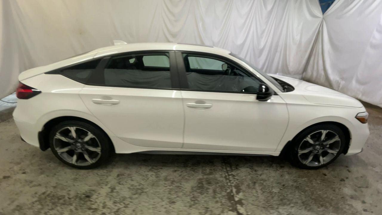 2025 Honda Civic Hatchback Hybrid Sport Touring - Platinum White Pearl exterior view 9