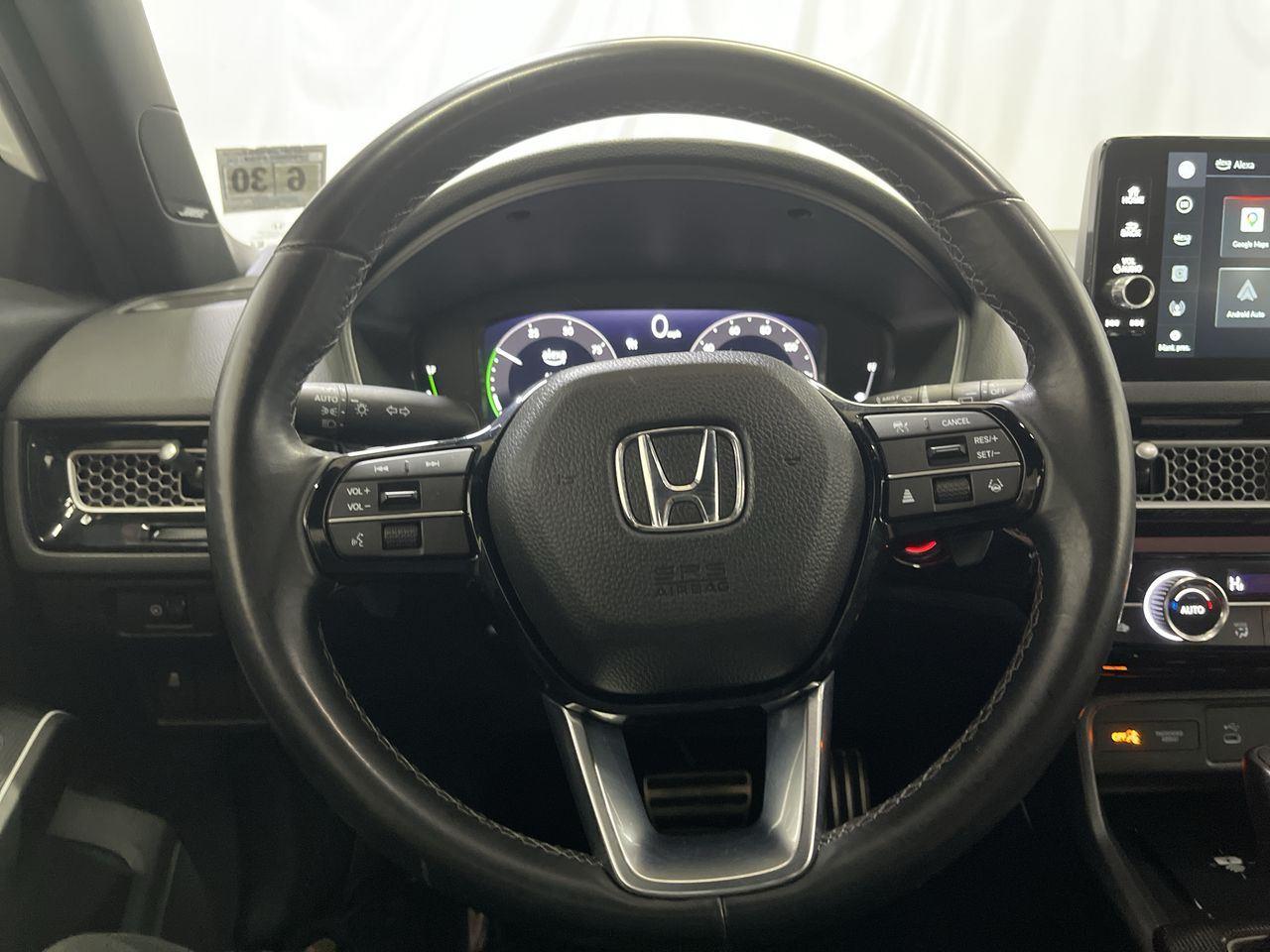 2025 Honda Civic Hatchback Hybrid Sport Touring - Platinum White Pearl exterior view 14