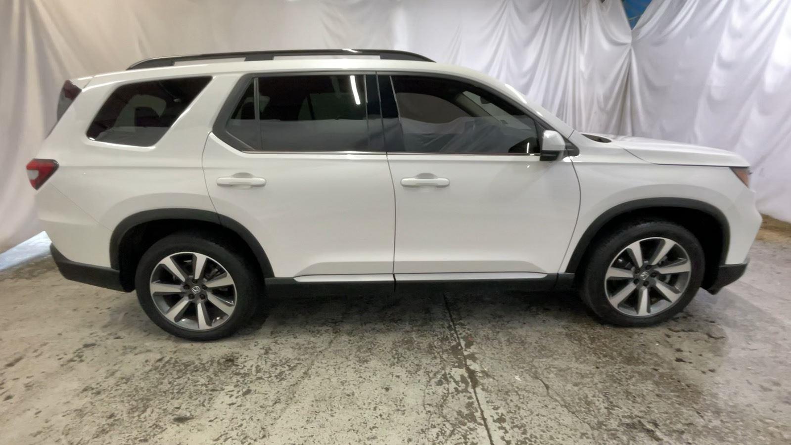 2025 Honda Pilot Elite - Platinum White Pearl exterior view 4