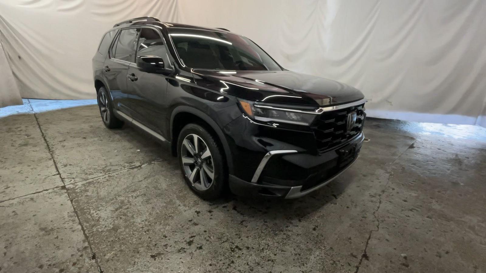 2024 Honda Pilot Elite - Crystal Black Pearl exterior view 2