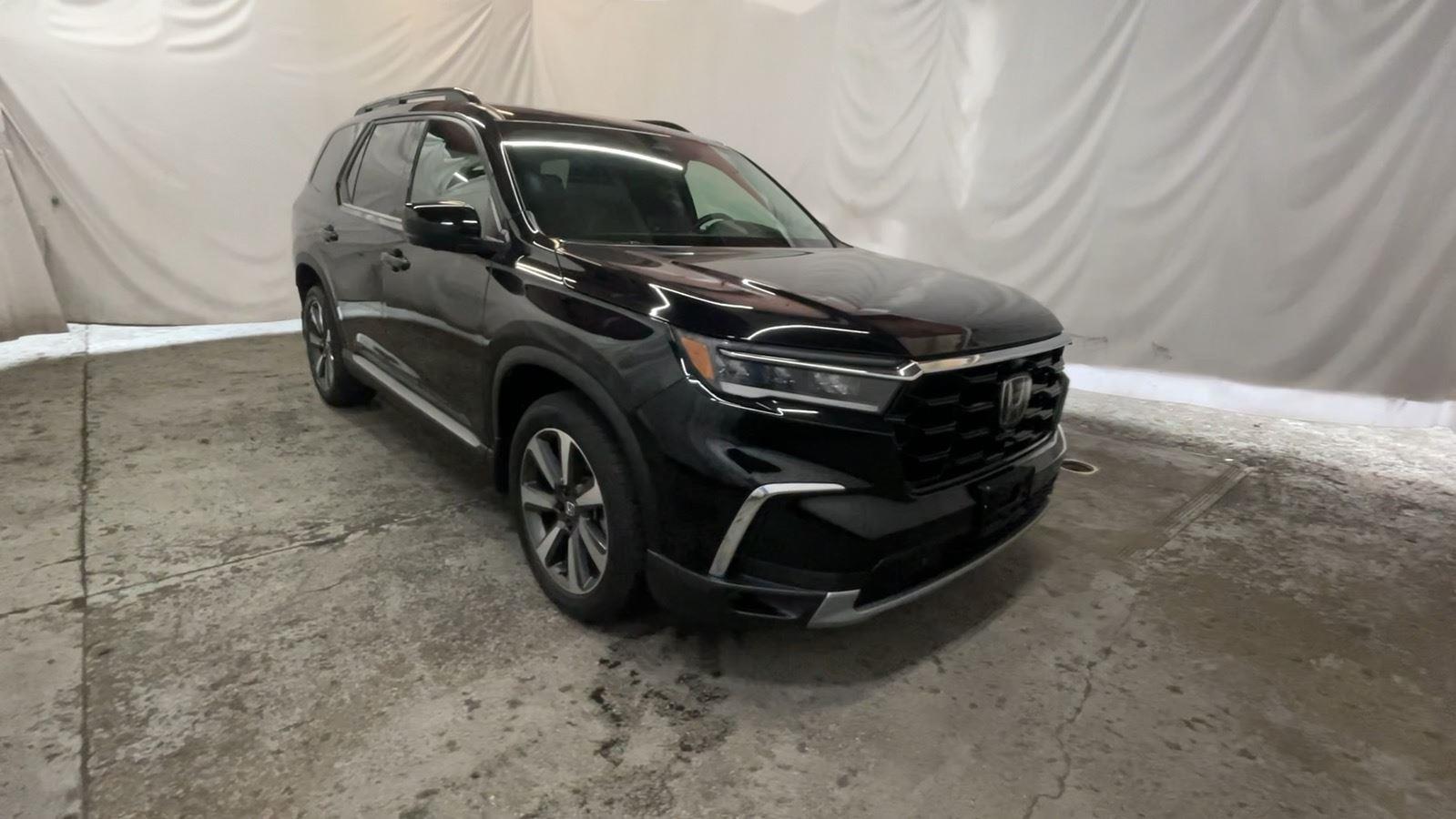 2025 Honda Pilot Elite - Crystal Black Pearl exterior view 2