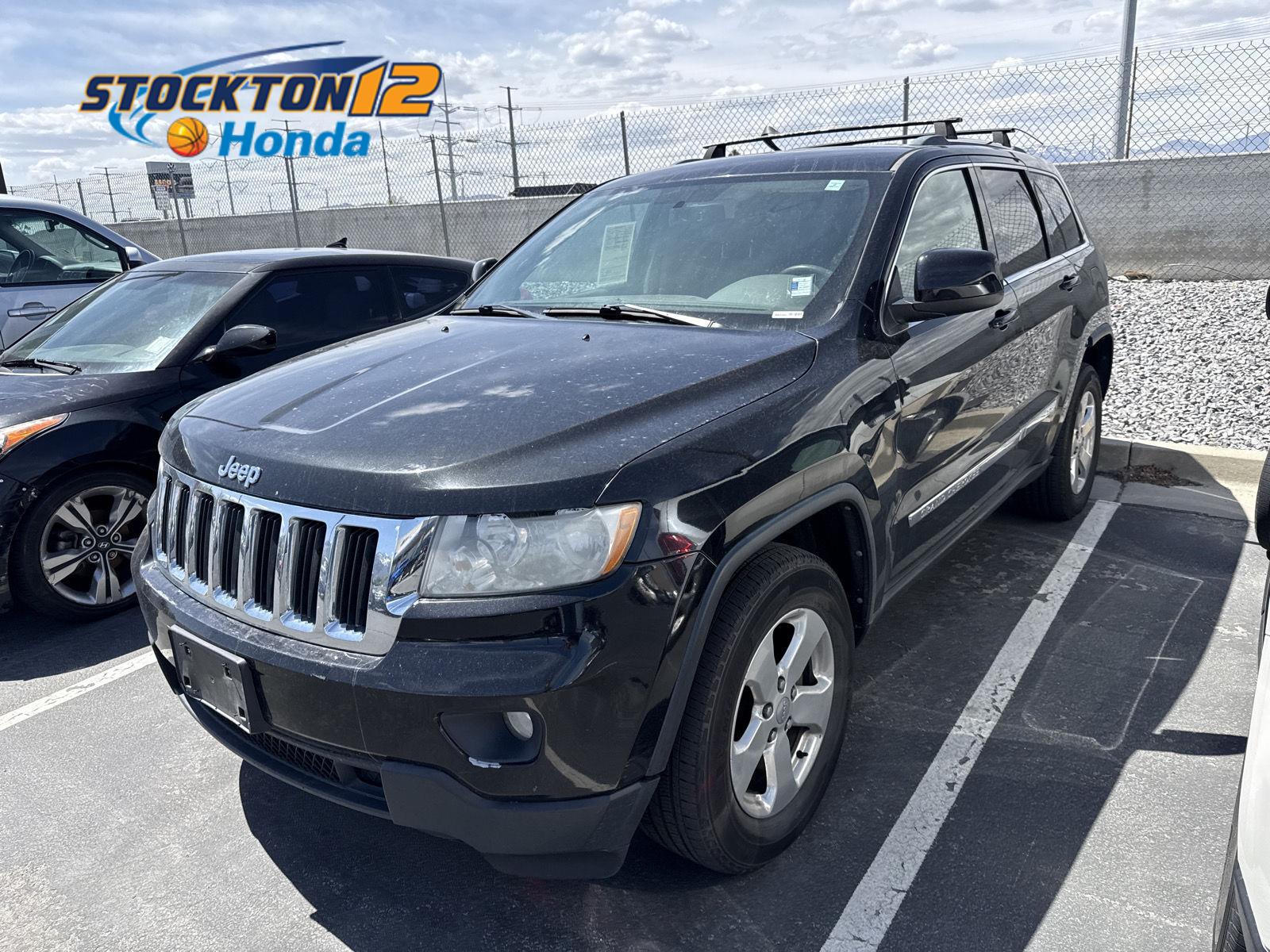 Brilliant Black Crystal Pearl 2012 Jeep Grand Cherokee Laredo 4WD SUV / Crossover Four-Wheel Drive 5-Speed Automatic