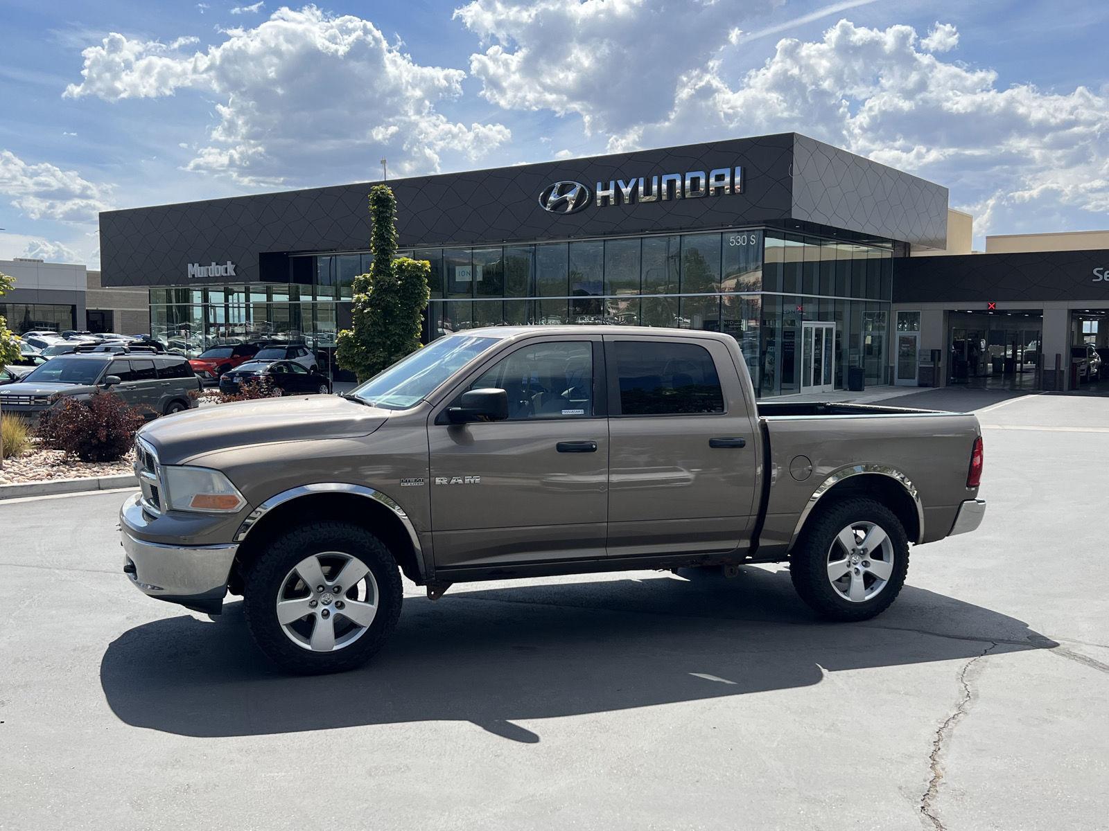 Brown (Austin Tan Pearl) 2009 Dodge RAM 1500 Pickup Truck Four-Wheel Drive 5-Speed Automatic