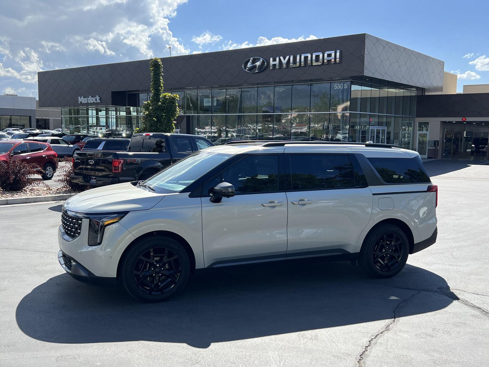 White (Ivory Silver Gloss) 2025 Kia Carnival Hybrid Minivan Front-Wheel Drive 6-Speed Automatic